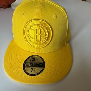 New Era - Brooklyn Nets.   Yellow.  Never worn